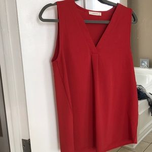 Burnt red color top. Sleeveless